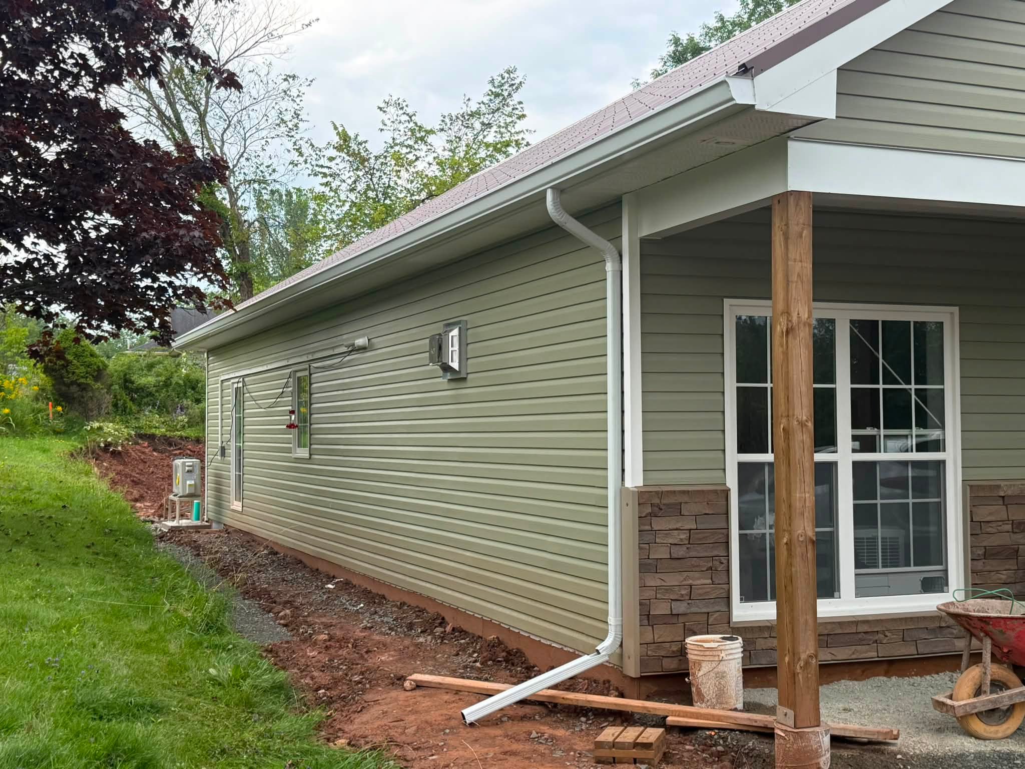 Seamless eavestrough and downspouts installed on a new home