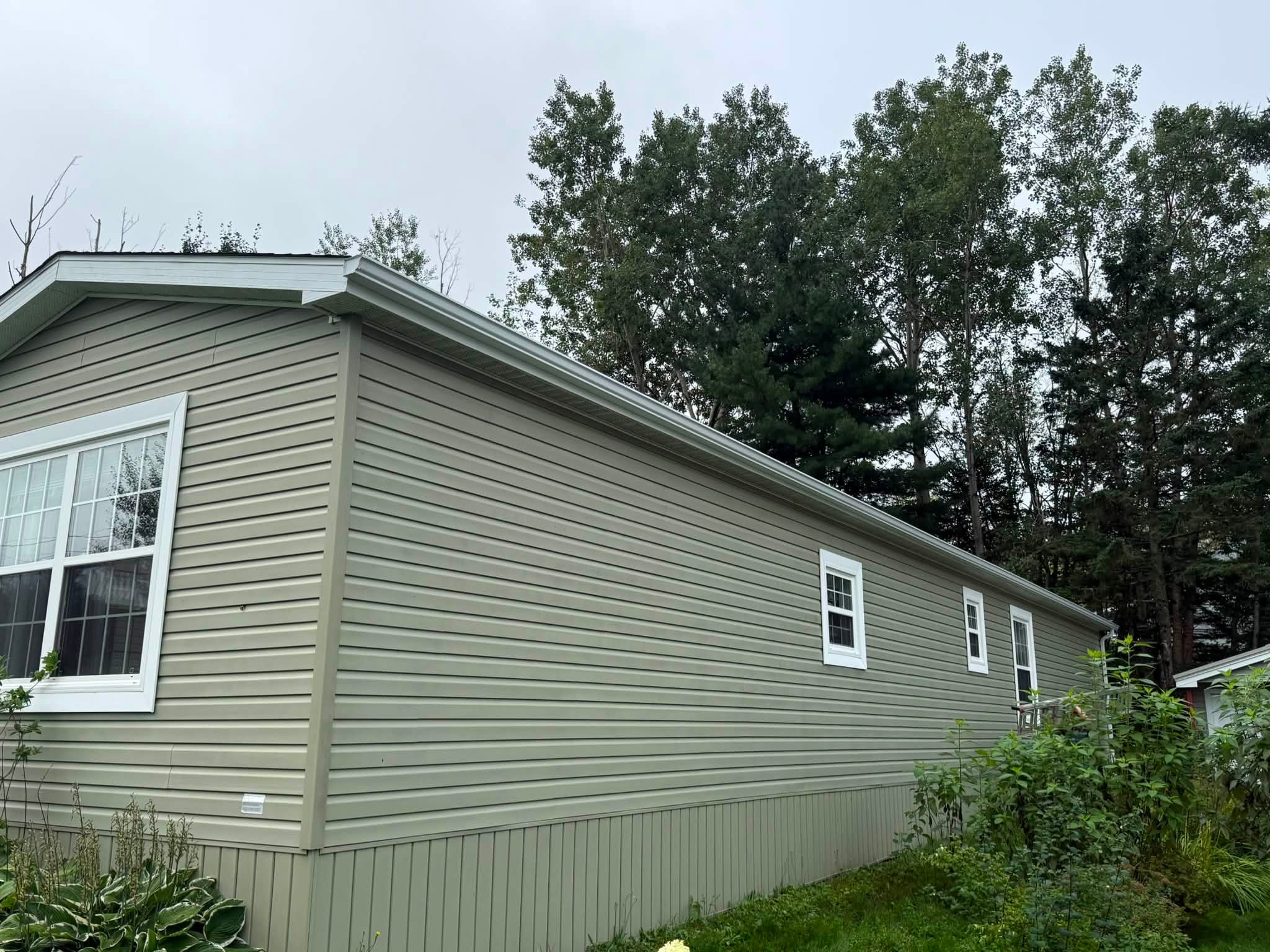 Finished siding and eavestrough on a residential property