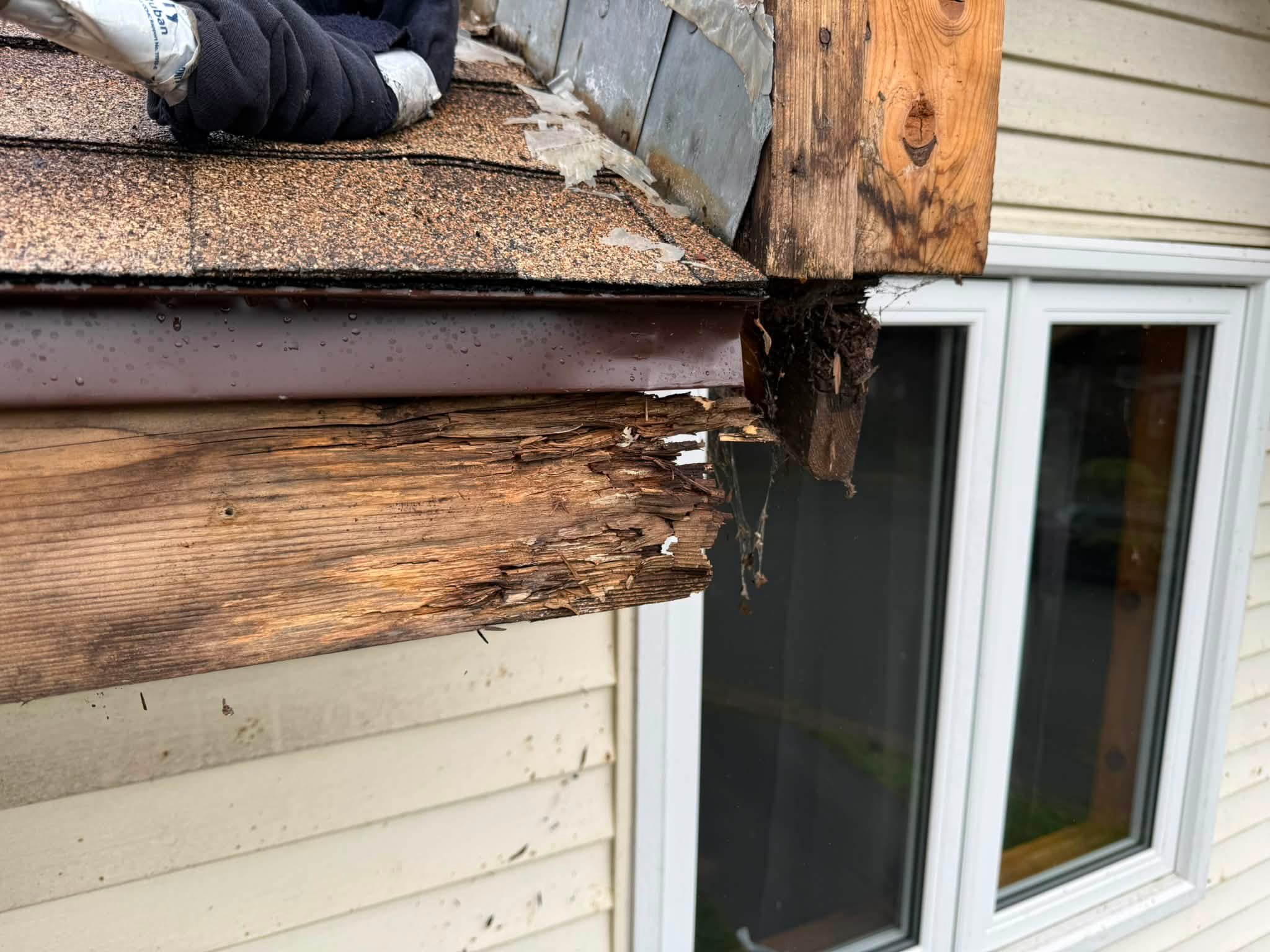 Deteriorated fascia board exposed during repair