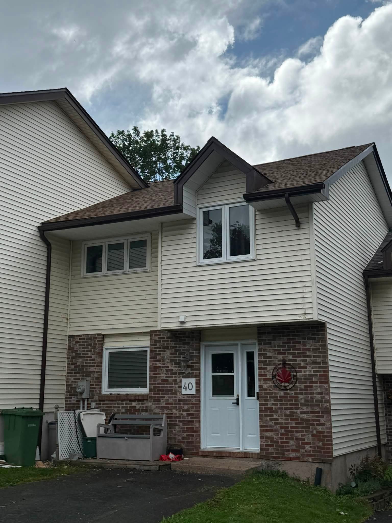Finished fascia eavestrough and downspouts after repair